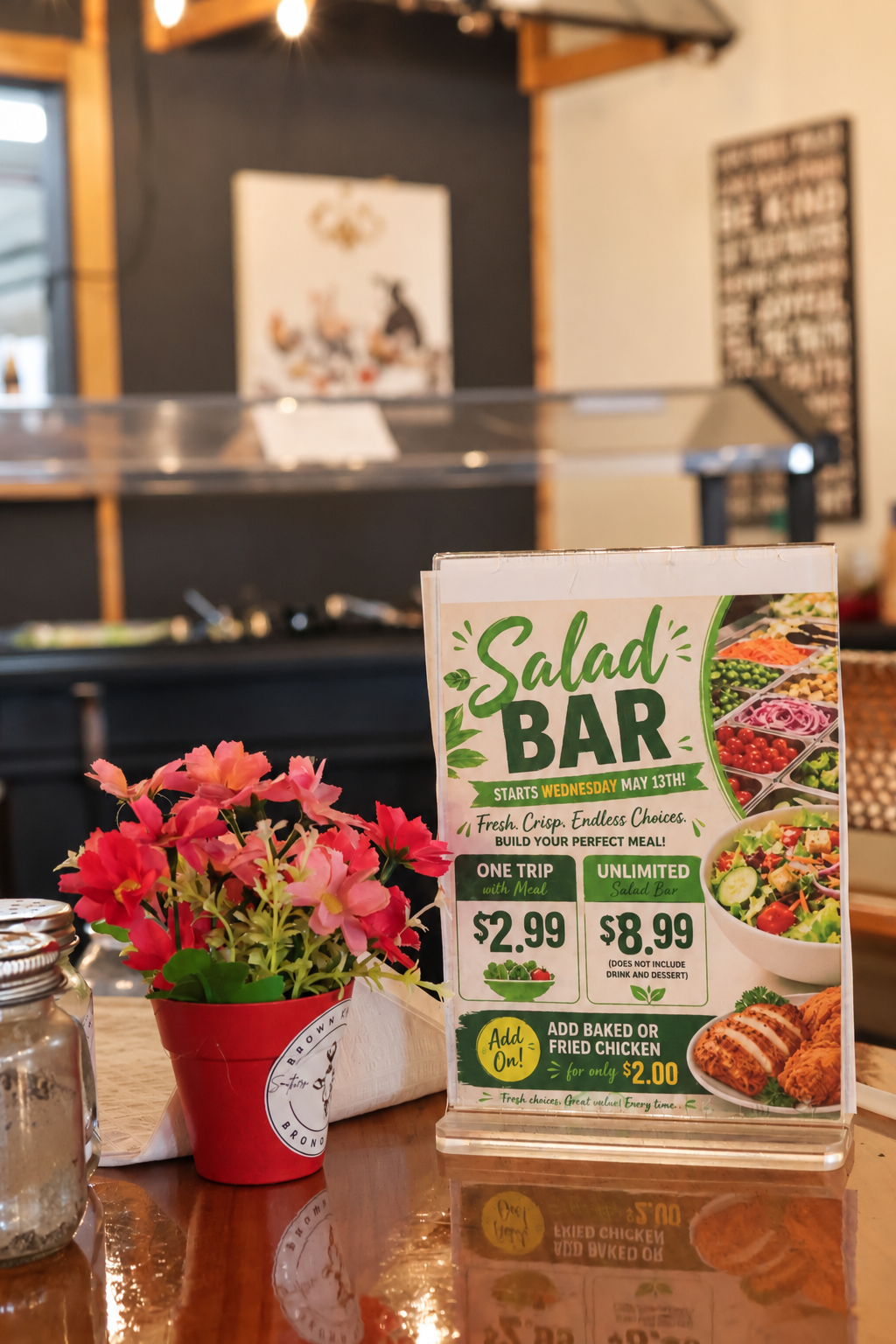 Salad bar sign and flowers inside Brown Chicken Brown Cow in Carrollton, Georgia
