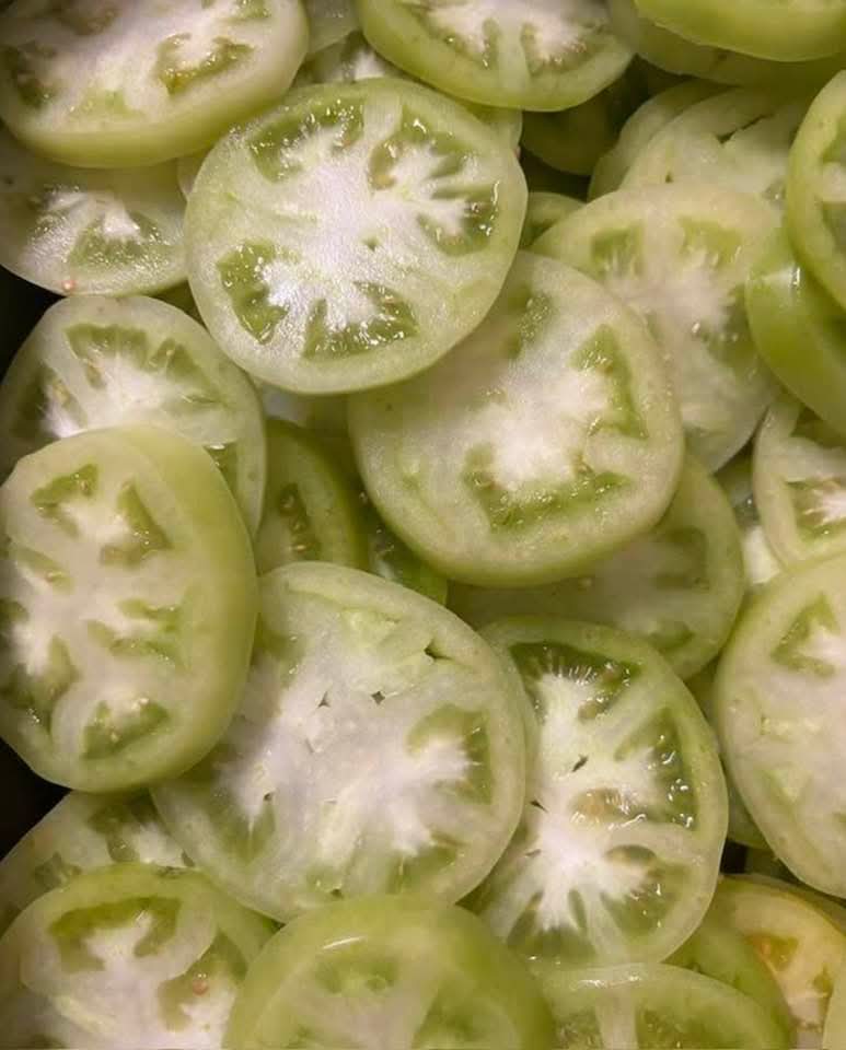 Green tomatoes sliced fresh, ready for the fryer